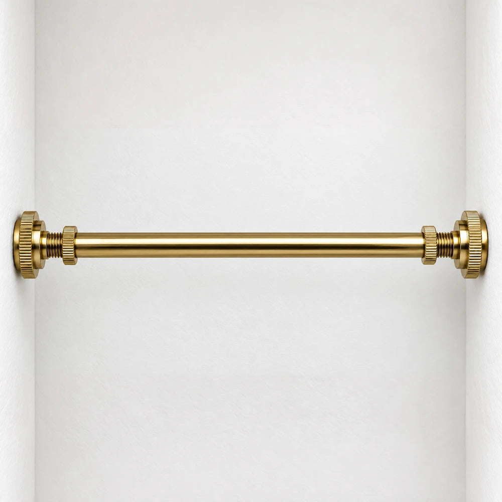 Simplifit brass towel bar with gold finish and wall-mounted brackets shown against a white wall, suitable for bathroom use.