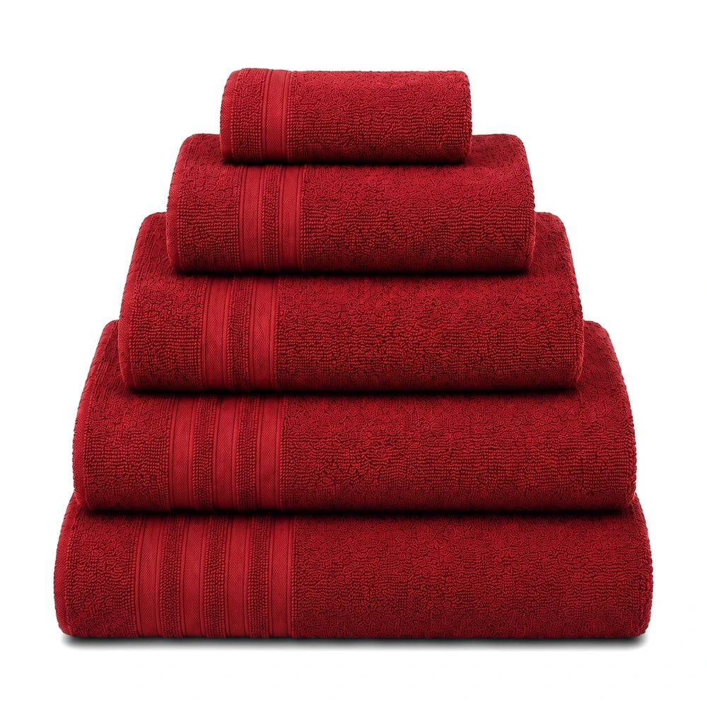 A pyramid stack of vibrant red Everyday Towels, made from soft terrycloth material, presented neatly on a clean background.