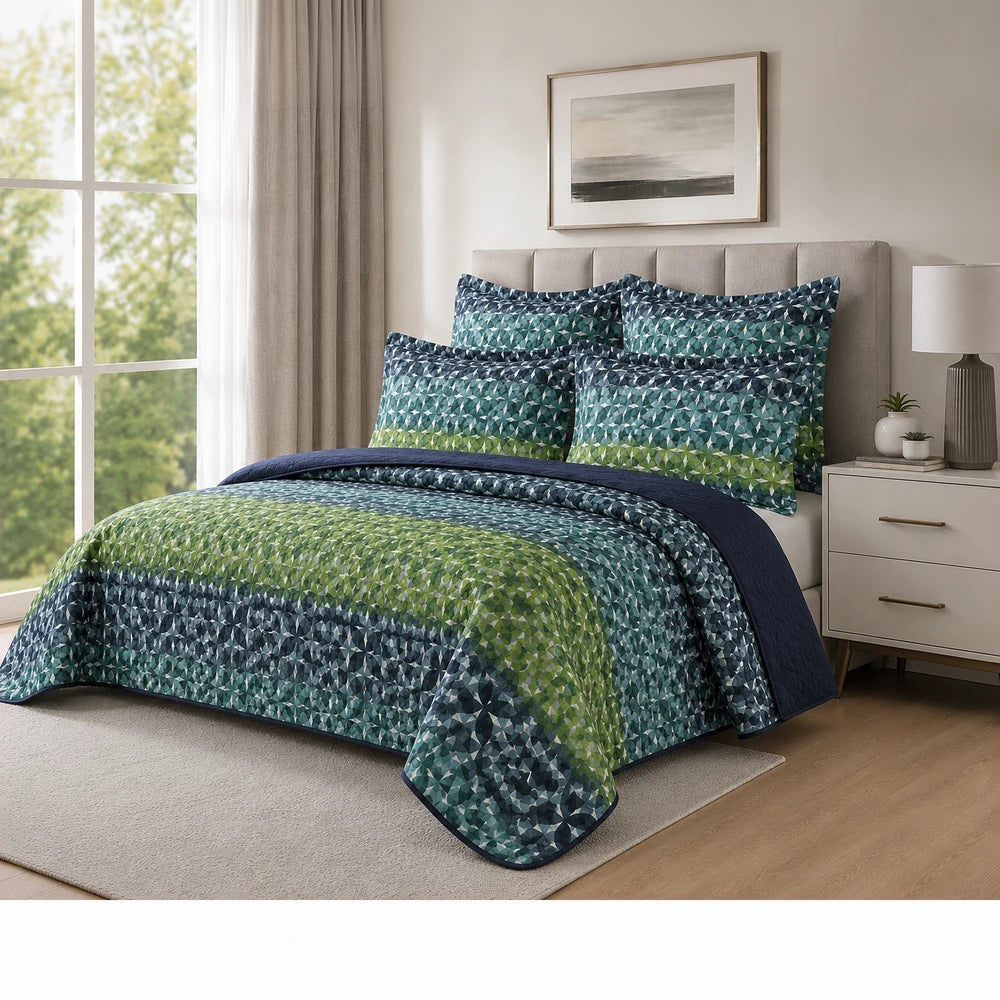 5PC Tela Milano Printed Quilt Set on a bed with a blue-green geometric pattern and matching pillow shams for a coordinated