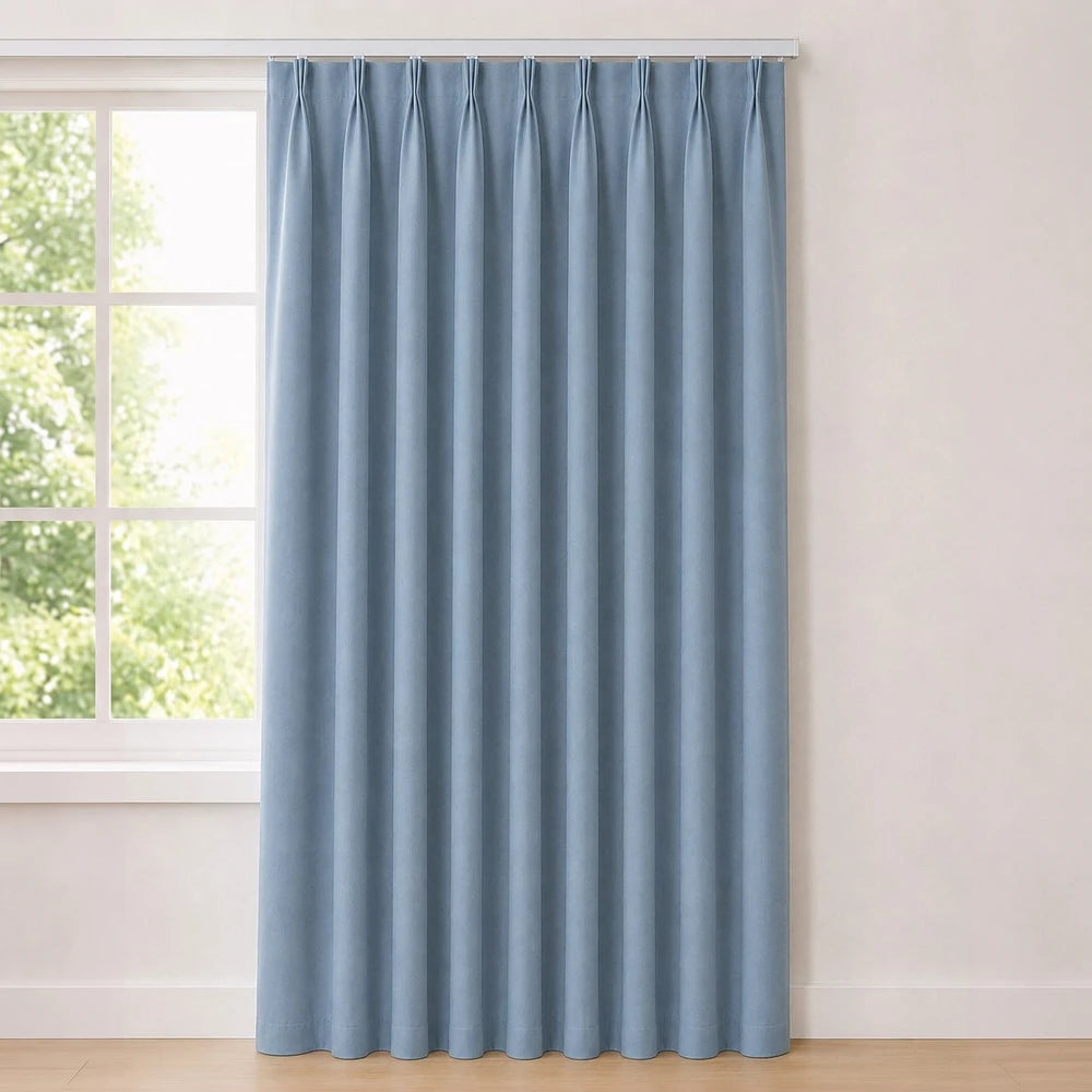 The Bahamas Unlined Taped Curtain in soft blue fabric with a taped header for a clean, modern window treatment.