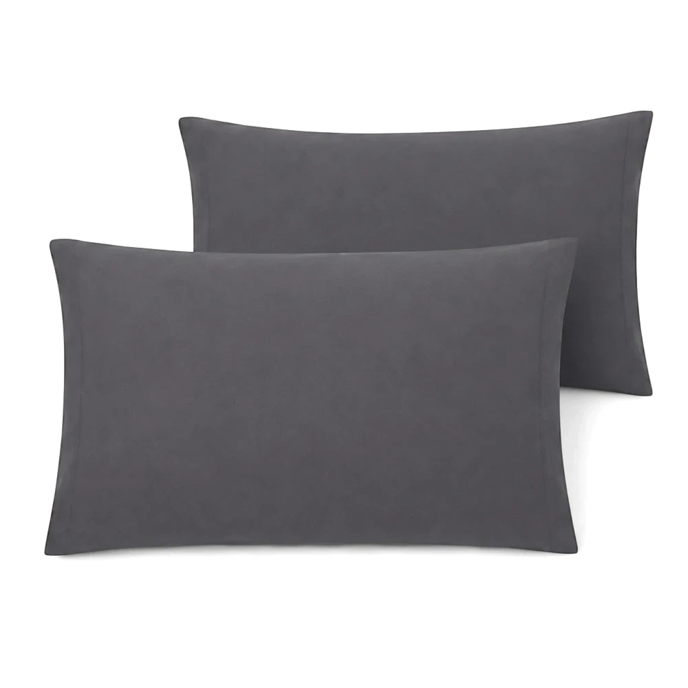 Two dark grey Whisper Soft Microfibre standard pillowcases are stacked, showcasing their soft texture and subtle sheen.