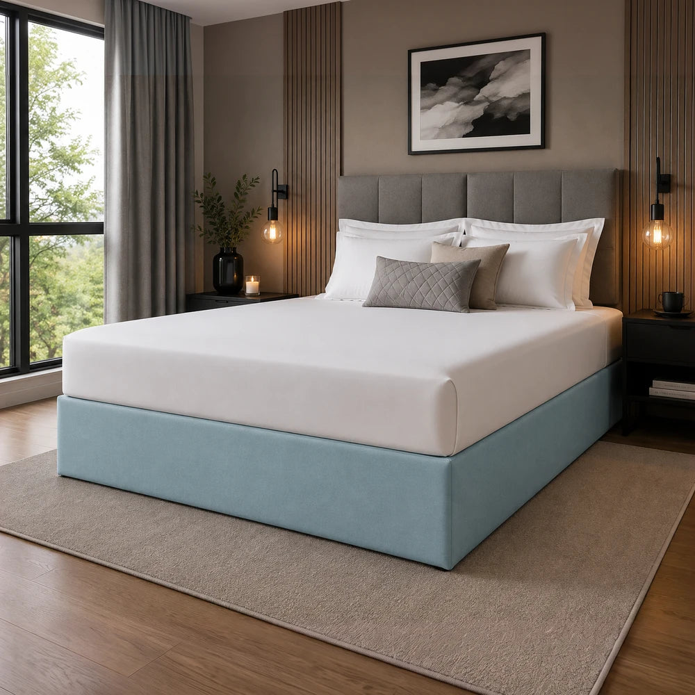 Whisper Soft Microfibre Bedwrap on a light blue upholstered bed base with white bedding and a gray headboard.