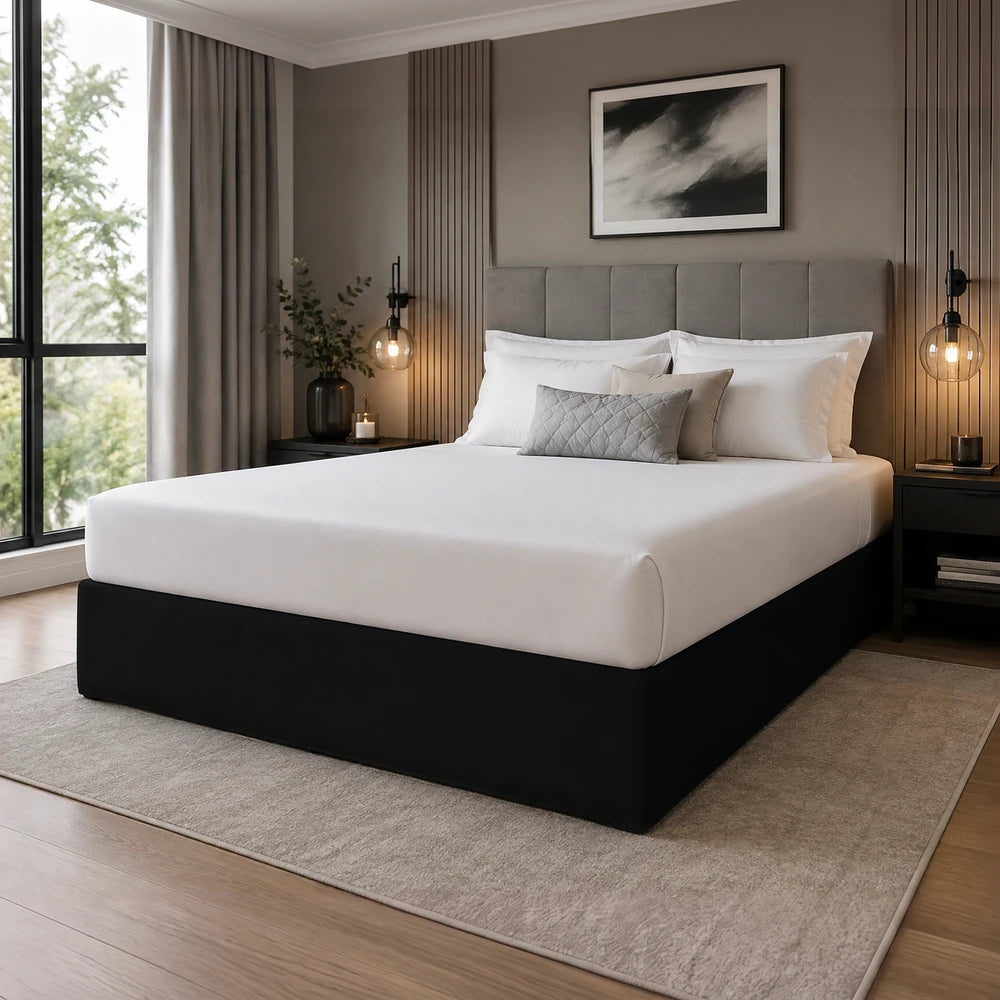Whisper Soft Microfibre Bedwrap on a king bed with white linens and a gray upholstered headboard in a modern bedroom.