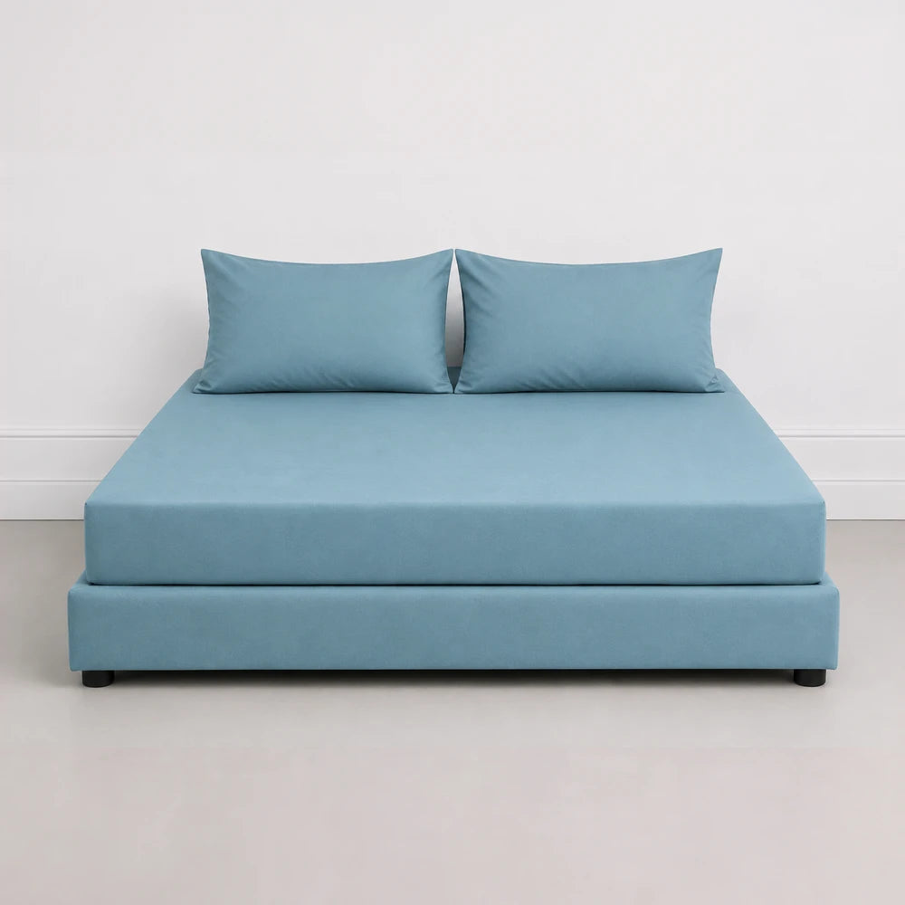Whisper Soft microfiber Easybed combo set displayed on a blue bed with matching blue pillows, showcasing smooth fabric and a