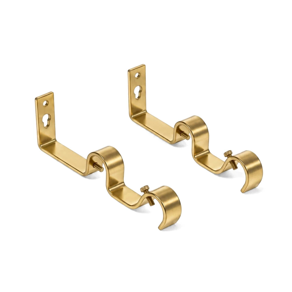 A pair of 25mm heavy-duty double brackets made from brass-colored metal, designed for curtain rods, displayed on a white