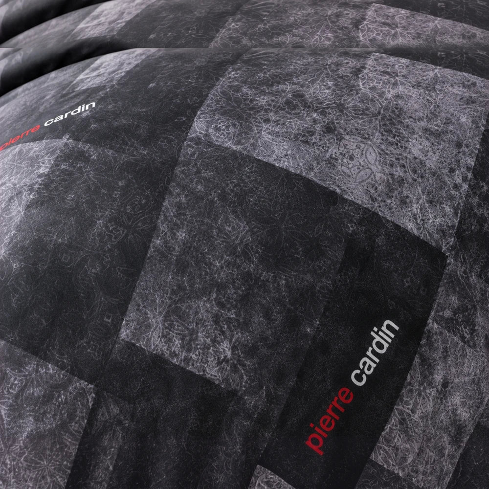 3 Piece Pierre Cardin Comforter set featuring a dark geometric quilted pattern and subtle textured greys.