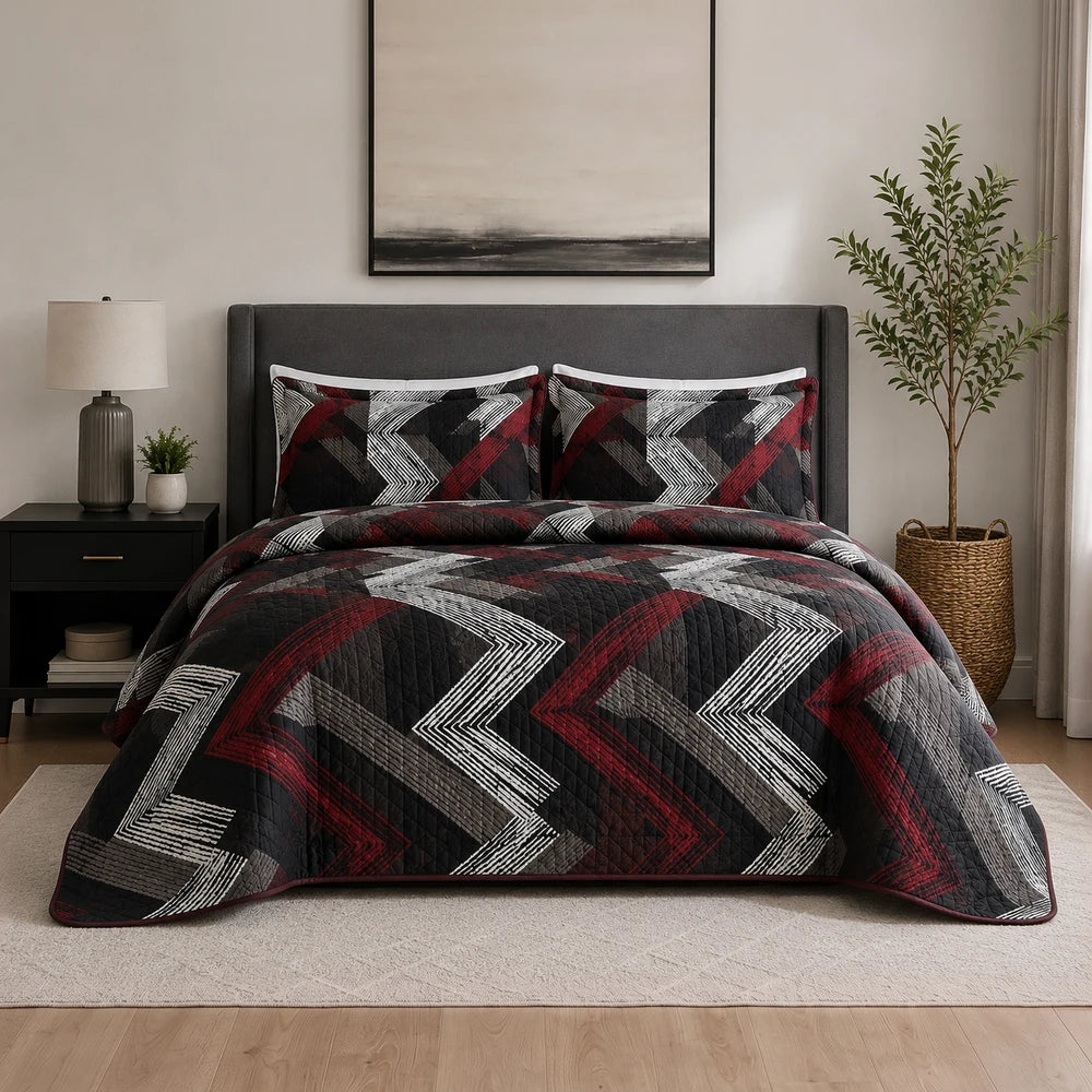 3PC Tela Milano Indep Comforter set in black, red, and gray geometric chevron pattern with matching shams on a neatly made
