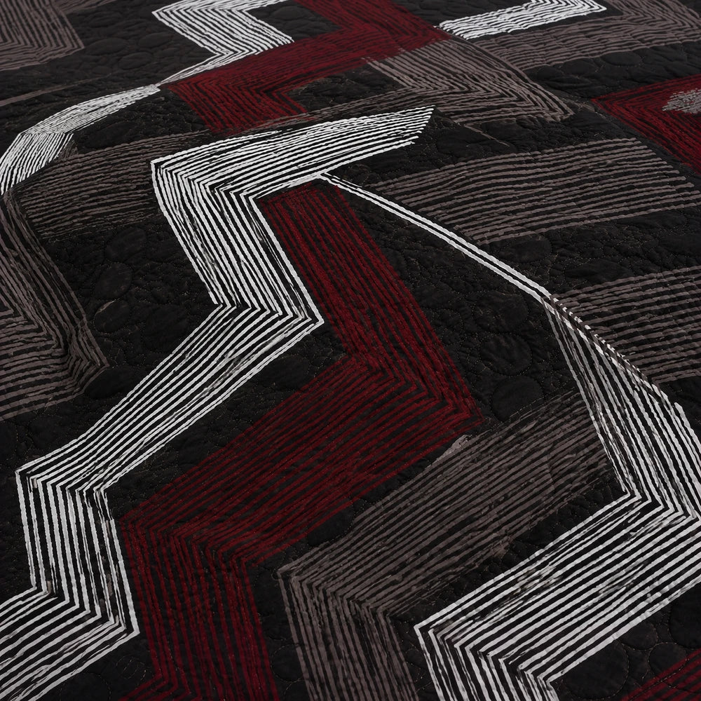 3PC Tela Milano Indep Comforter with a quilted geometric pattern in black, gray, and red; close-up highlighting the textured
