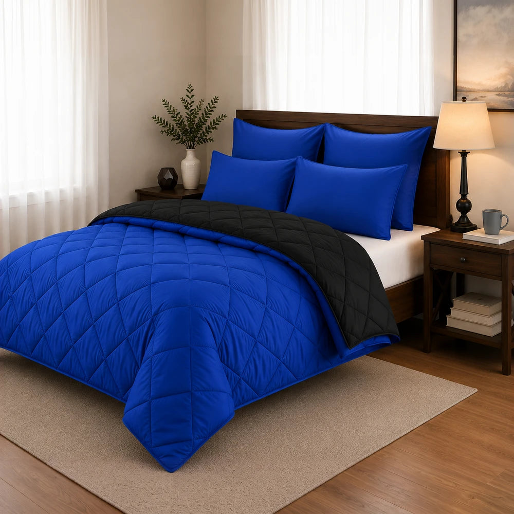 5Pc Pierre Cardin Monochrome Reversible Comforter set in blue with a black reverse and quilted stitching for warmth and