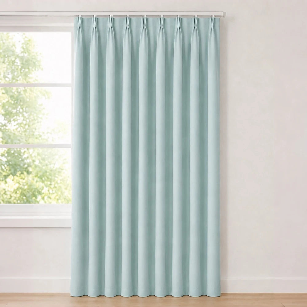The Bahamas unlined taped curtain in seafoam blue with a soft drape and hidden header for easy hanging.
