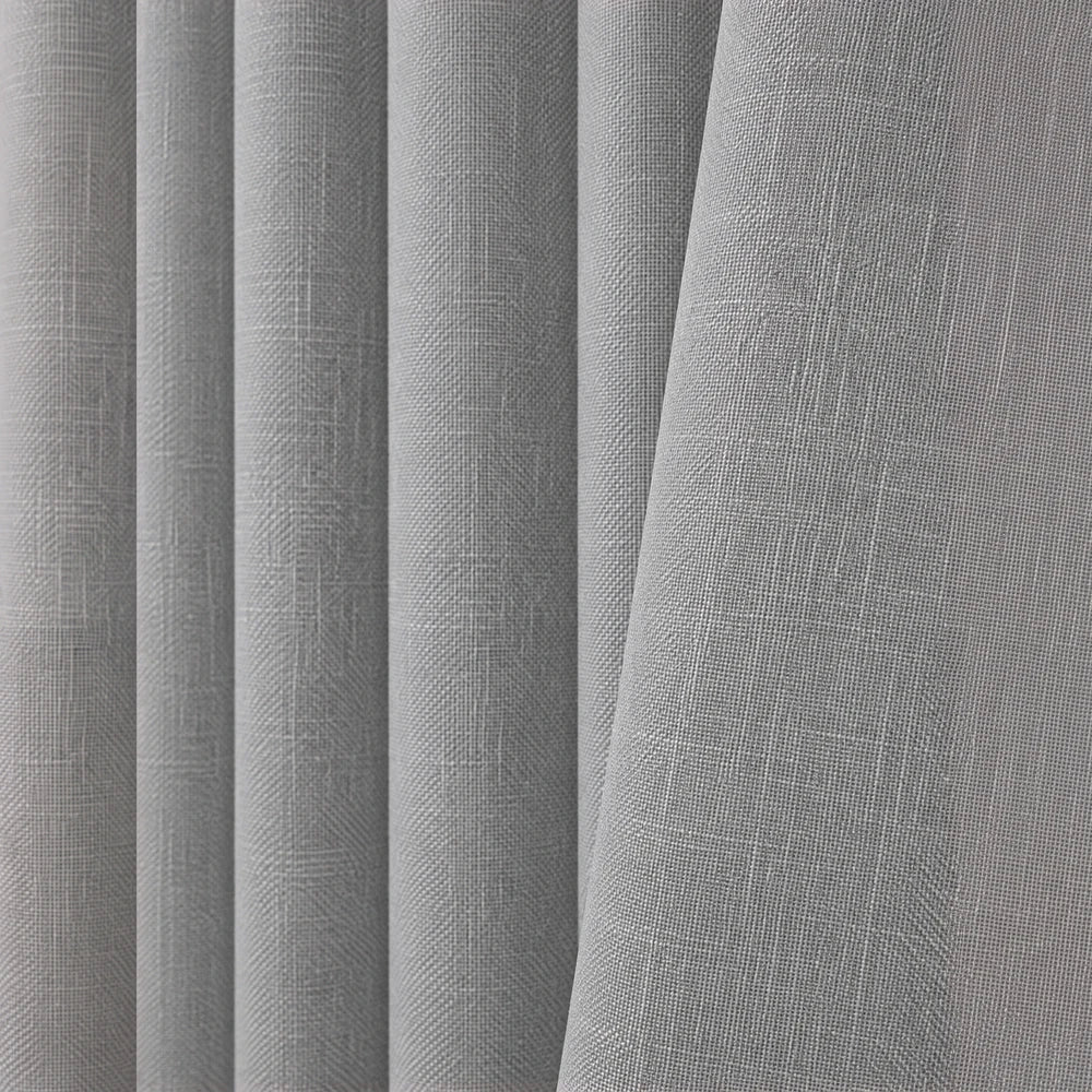 Barkweave Eyelet Lined Curtain in light gray textured fabric, showcasing a soft drape and modern, neutral appearance.