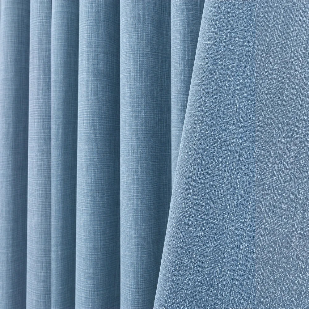 Barkweave Eyelet Lined Curtain in soft blue fabric with a woven texture and metal eyelet header.