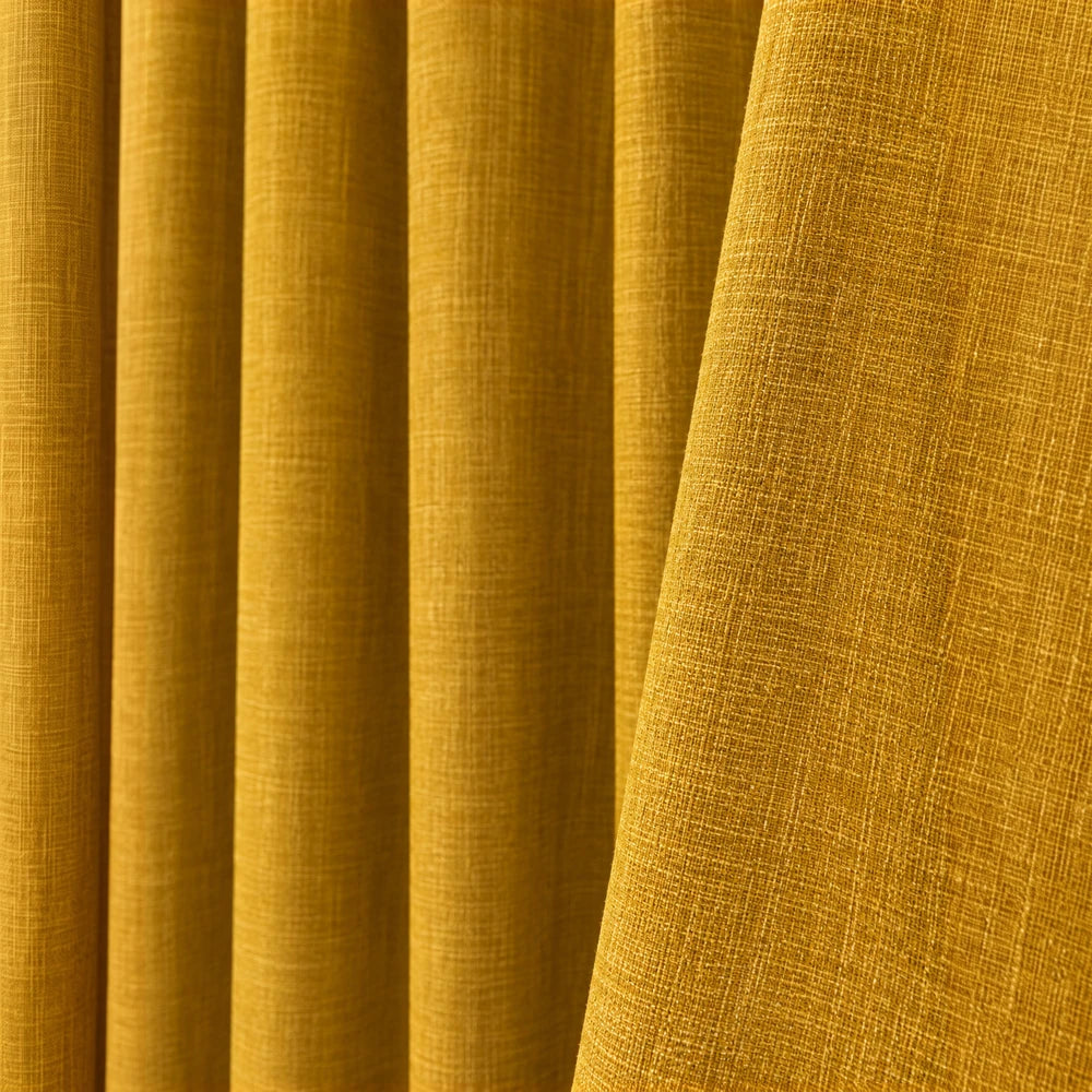 Barkweave Eyelet Lined Curtain in mustard yellow fabric, showing a textured woven surface and elegant drape.
