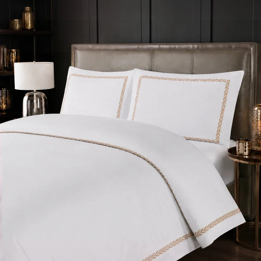 Carducci Serenity 100% cotton white bedding with gold braided border on duvet cover and pillowcases.