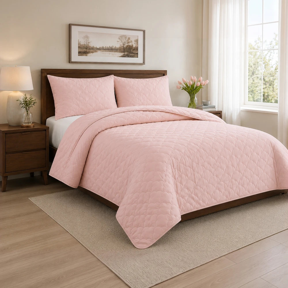 Carducci Washer Quilt Set in soft pink with a quilted pattern on a neatly made bed.