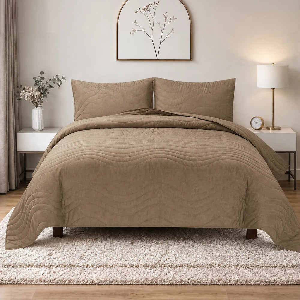 Premium Carducci Wave Pattern 100% cotton quilt set in taupe with matching pillow shams on a neatly made bed.