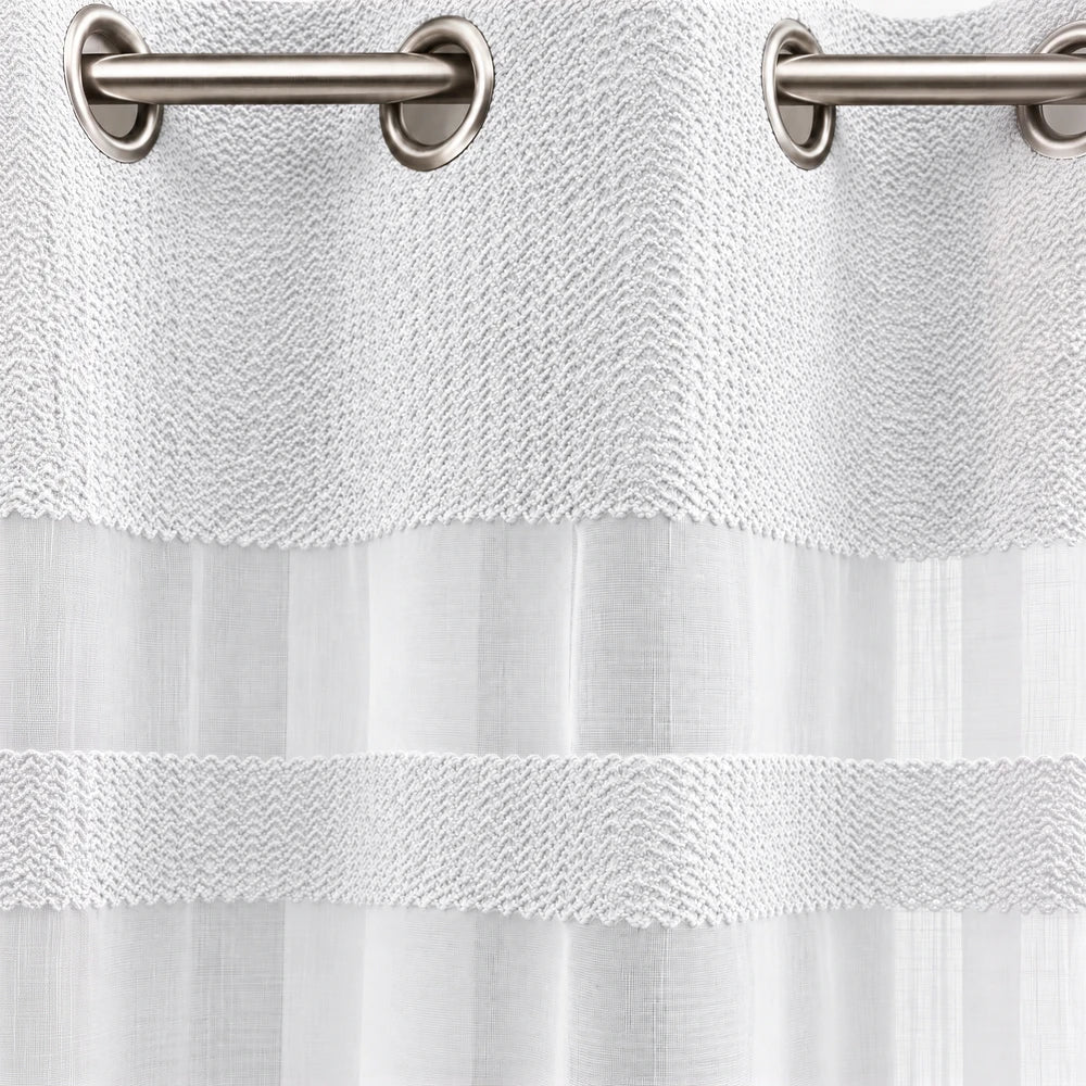Cecile Balza Alter Eyelet Curtain with textured knit header and sheer white panel, offering a soft layered look for living