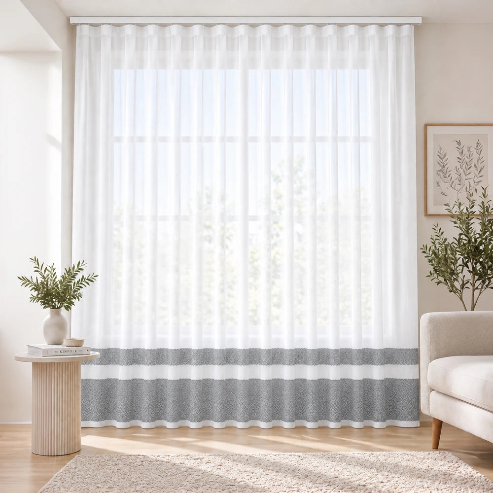 Cecile Balza Alter Taped Curtain in white sheer fabric with a subtle gray bottom band, ideal for bright living room windows.