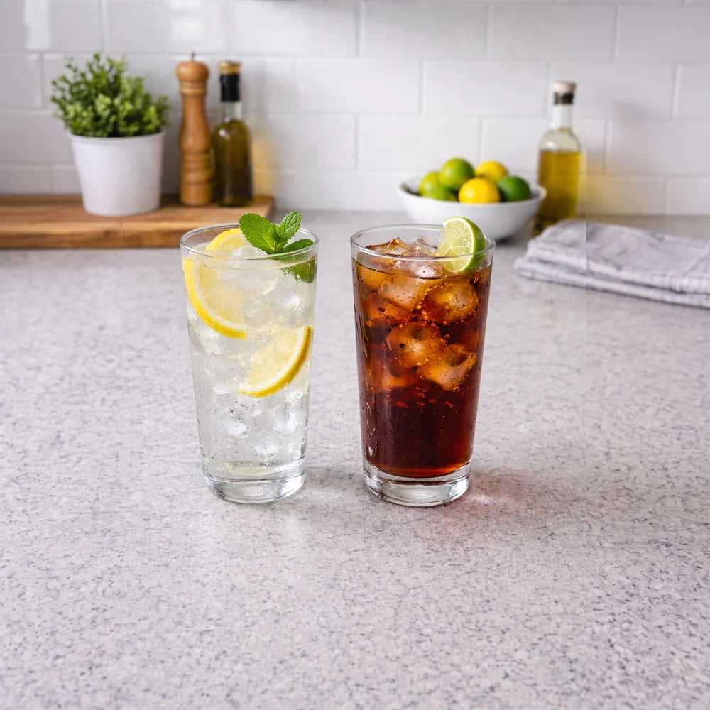 Classic 6-Piece Highball Glass Set in clear glass with ice, lemon slices, and mint for refreshing beverages.