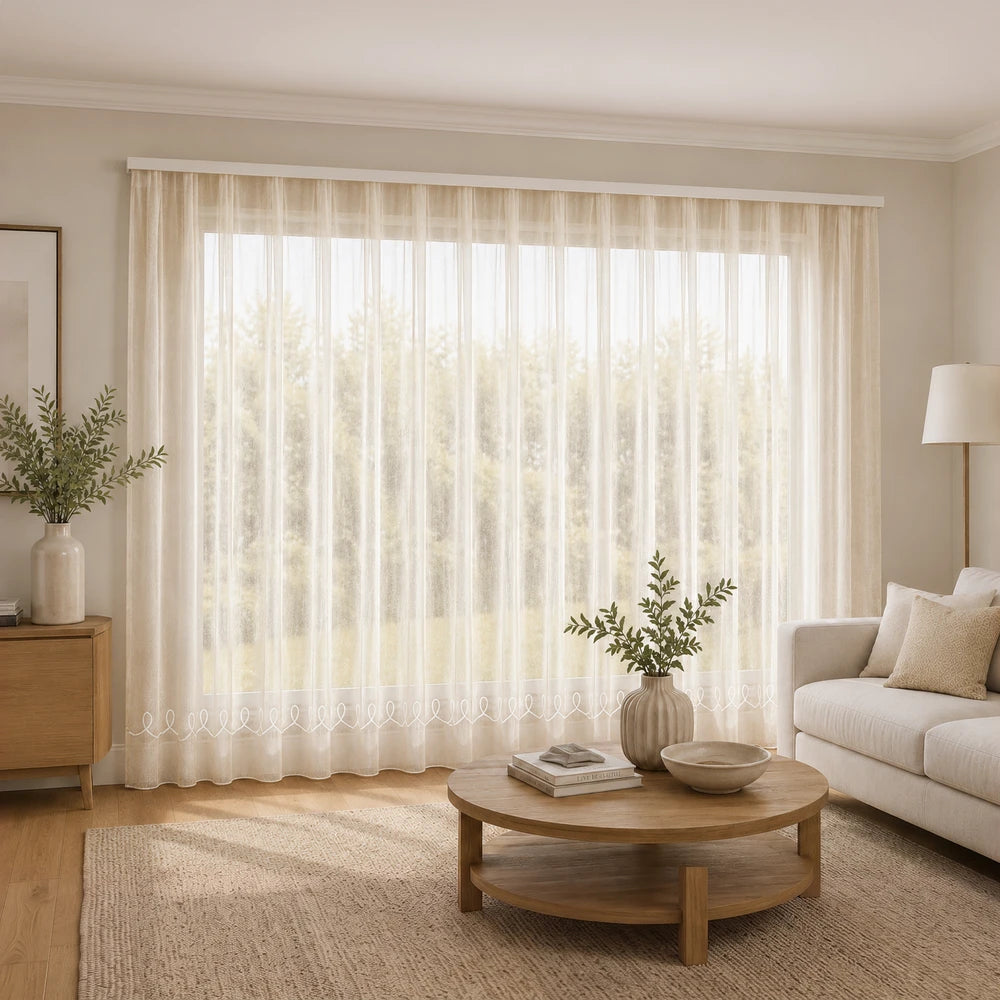 Cornely Plain Voile 5m taped curtain in cream beige, lightweight sheer fabric ideal for softening living room windows.