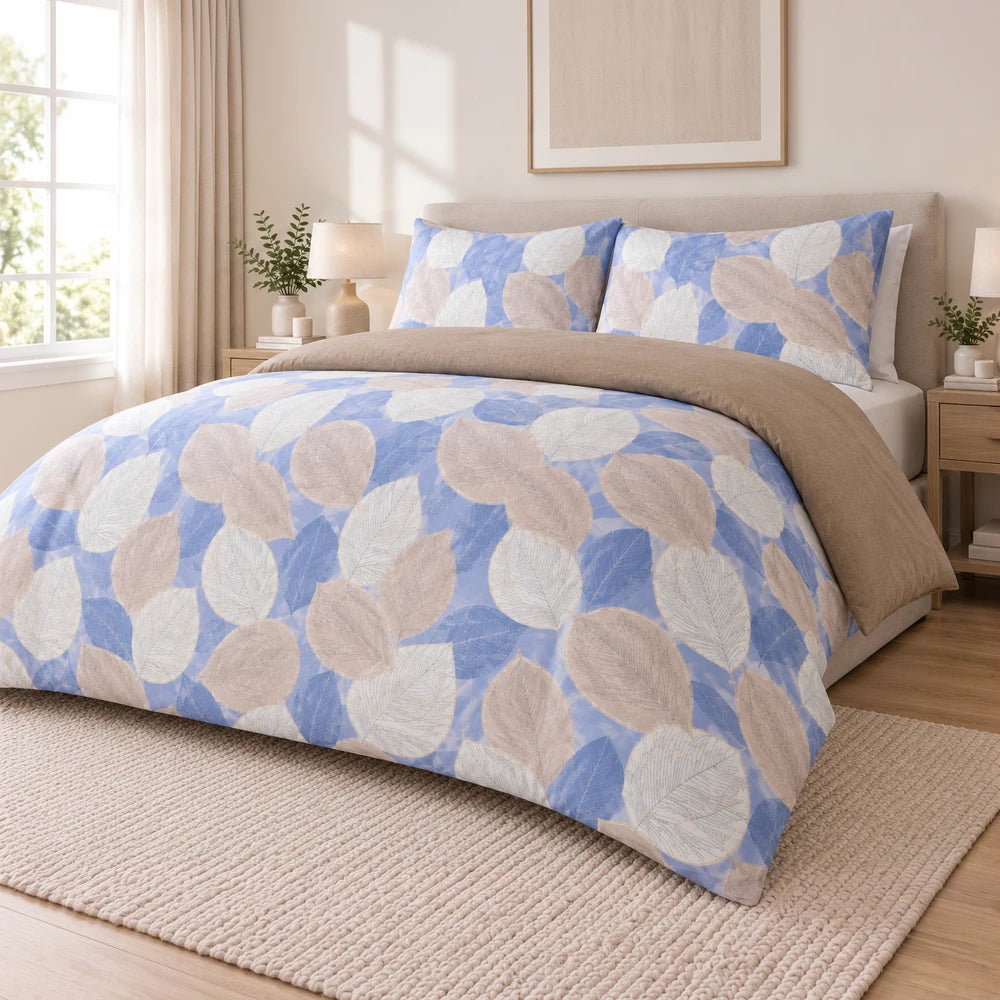 Cotton Co Duvet Cover Set - Margo featuring a blue and beige leaf print, soft cotton fabric and matching pillow shams for a