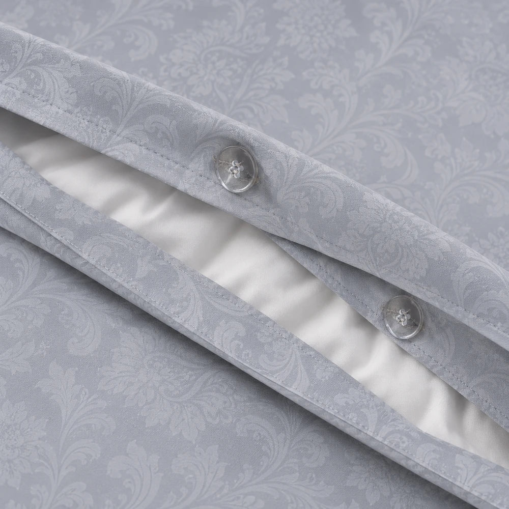 Cotton Co Kate Duvet Cover Set in grey with damask jacquard pattern and button closure for a soft, elegant bedroom look.