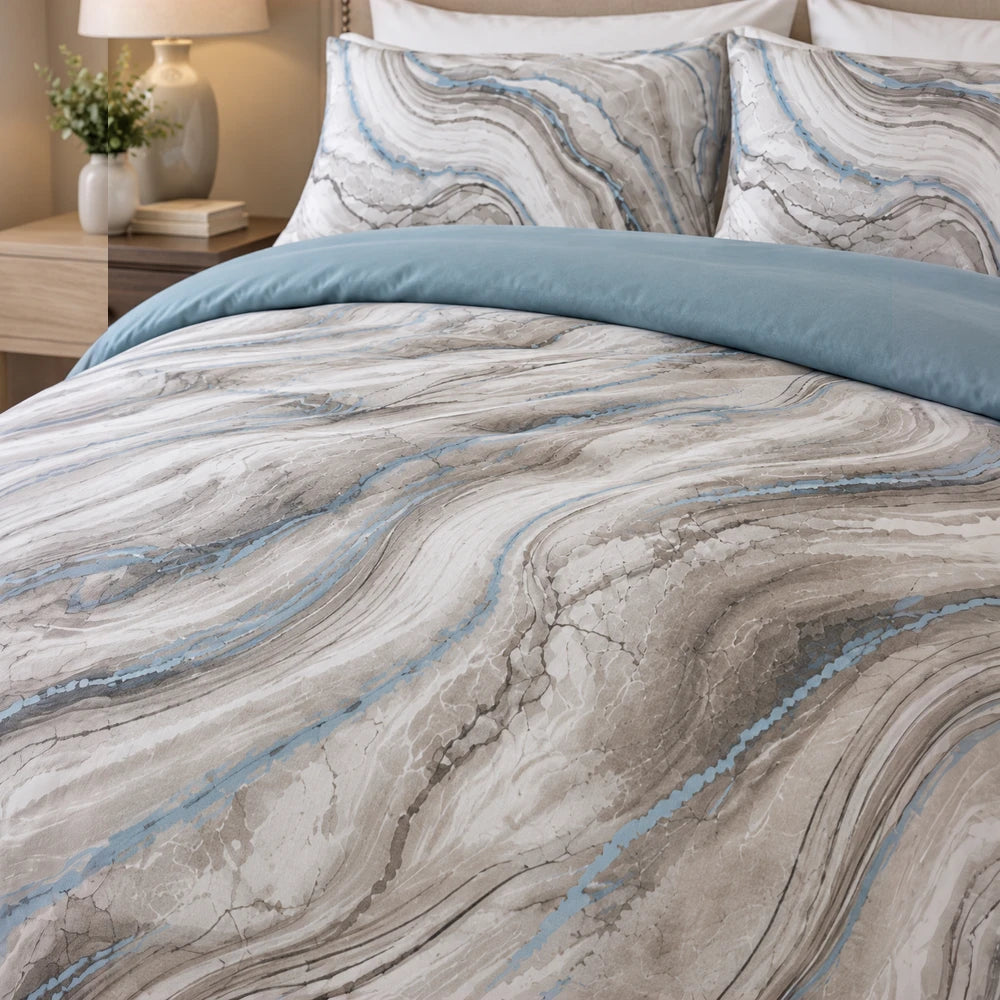 Cotton Co Premium Comforter Set in blue with gray marble-pattern print, includes matching shams for a coordinated bed setup.