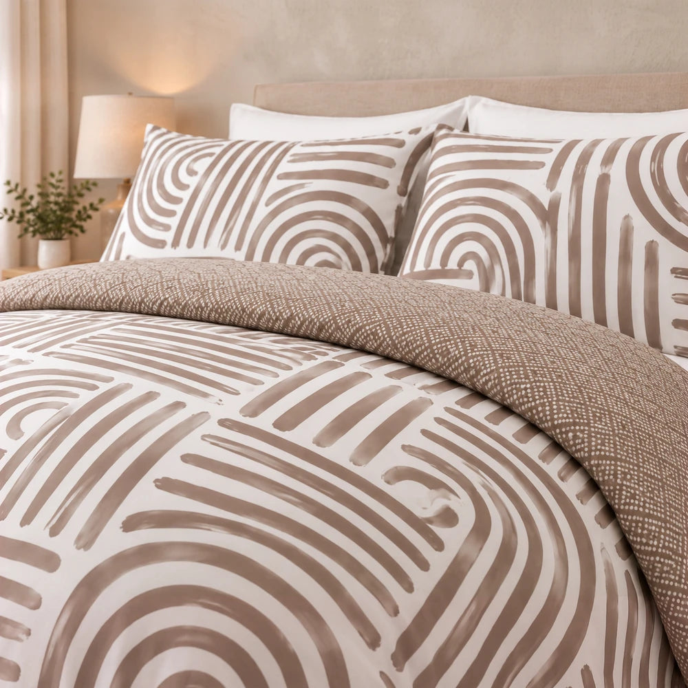 Cotton Co Zaria duvet cover set in beige-brown with an abstract circular pattern; includes duvet cover and pillowcases for a