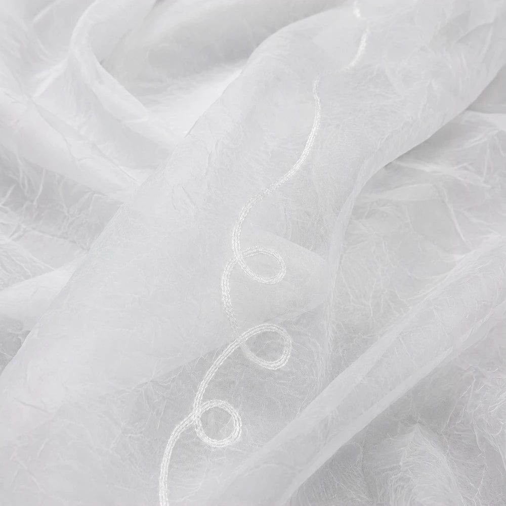 Crushed Cornely Voile 5m taped curtain in white, light, sheer fabric with decorative stitched swirl edge.
