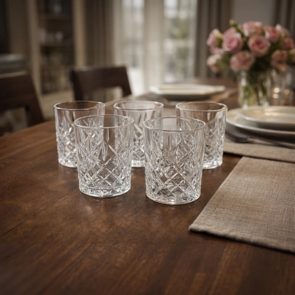 Crystal-cut whiskey tumbler glasses set of six on a wooden table, clear crystal with a diamond pattern for elegant serving