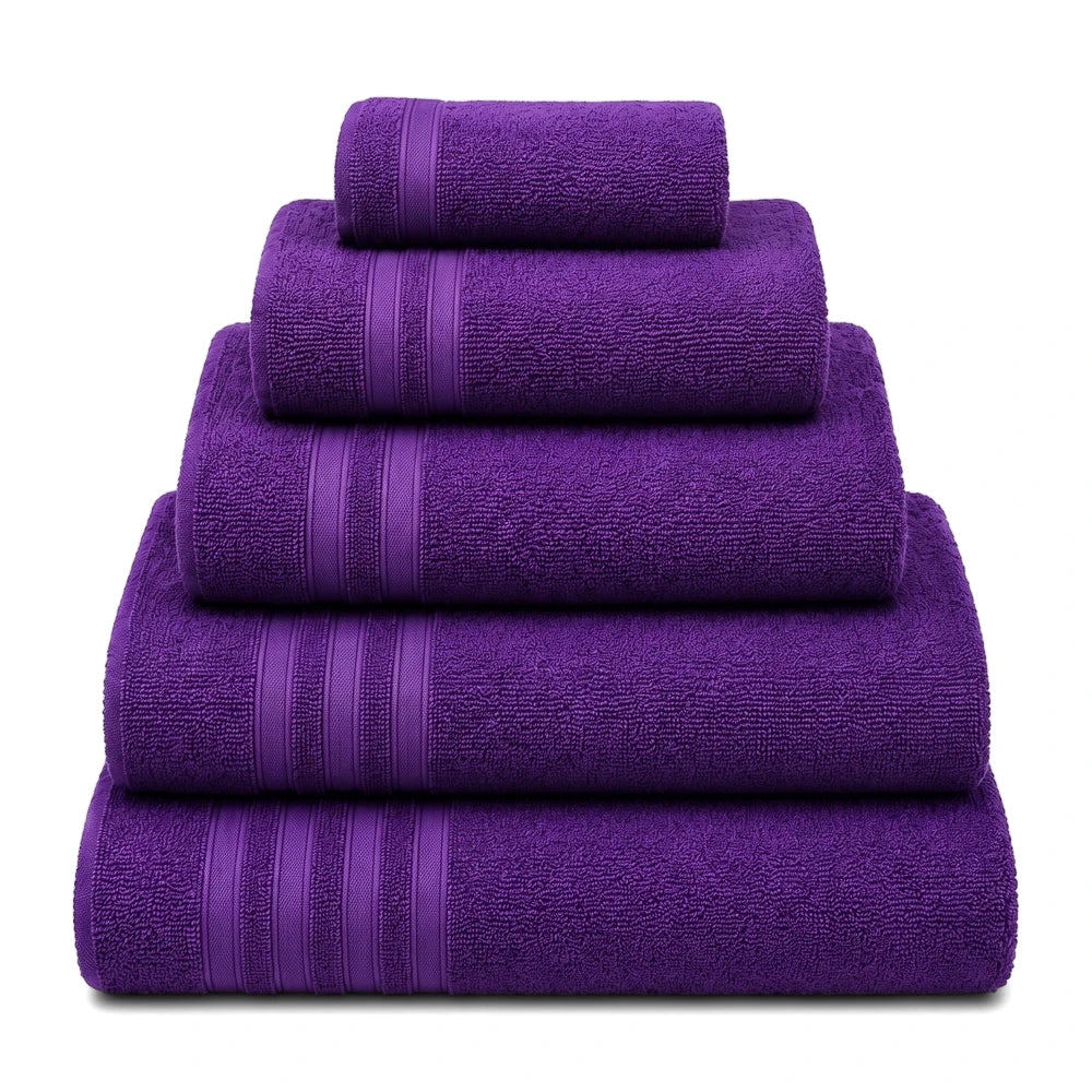 A pyramid stack of vibrant purple everyday terry cloth towels on a clean white background.