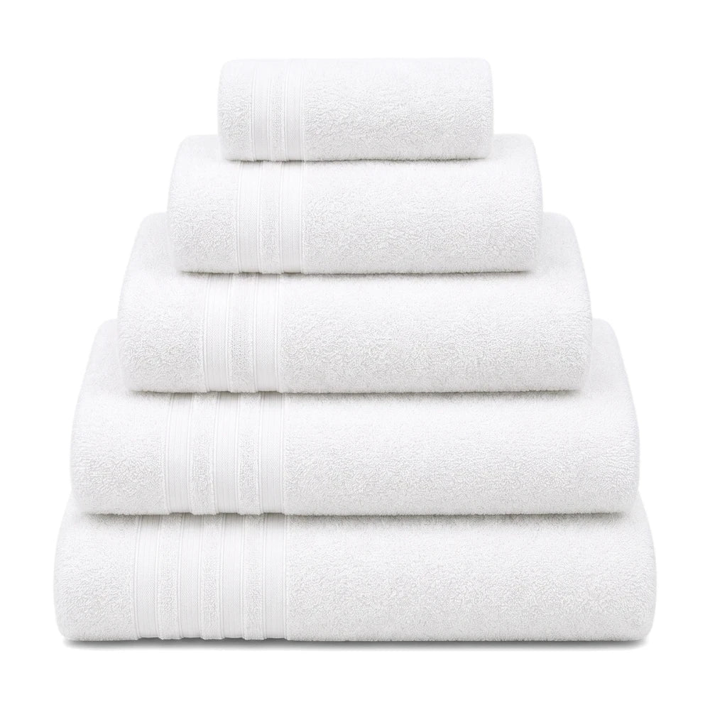 Five neatly folded white terry cloth everyday towels stacked in descending size, ready for use in a bathroom.