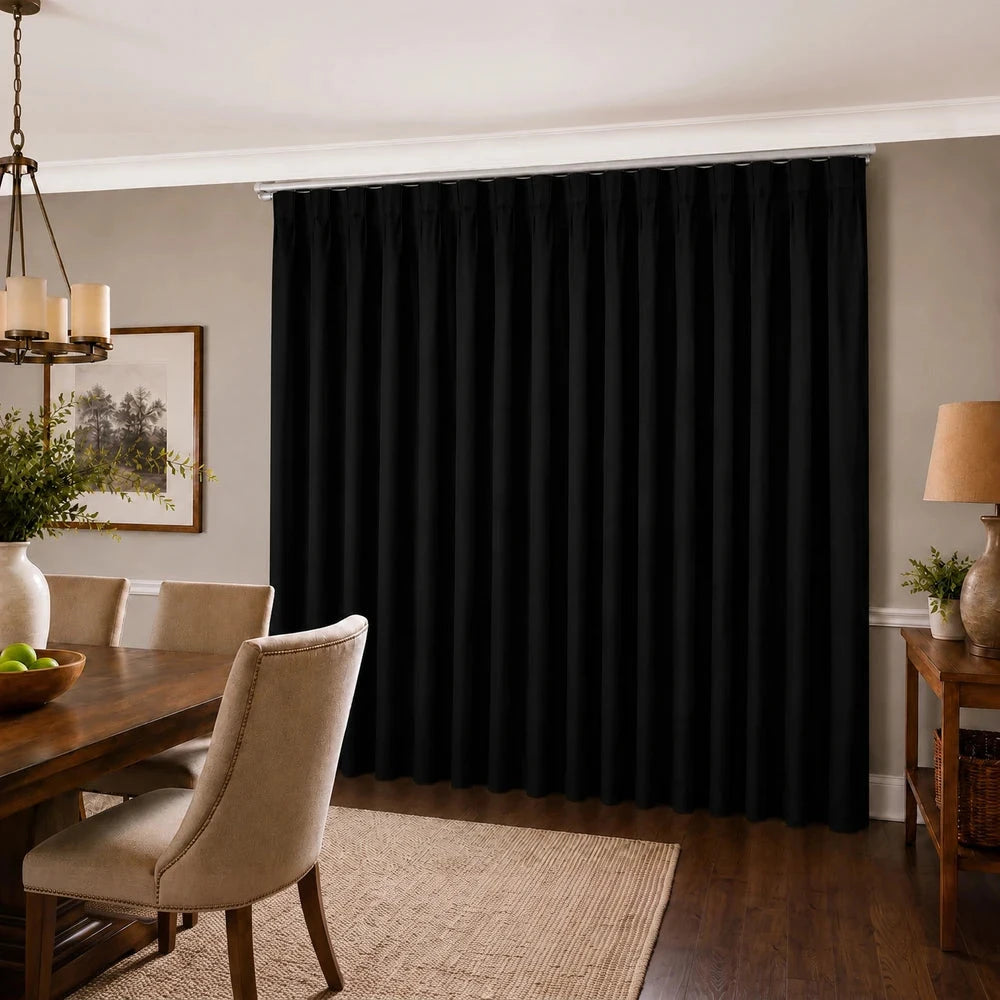Faux silk curtain taped and lined in black, shown as a full-length panel in a dining room for elegant shading and privacy.