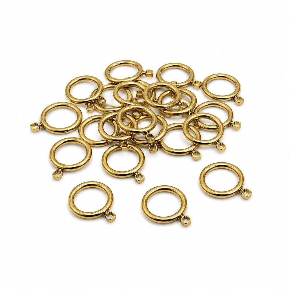 Gold 16mm curtain rod rings set with small square end tabs, metal finish for drapery rods.