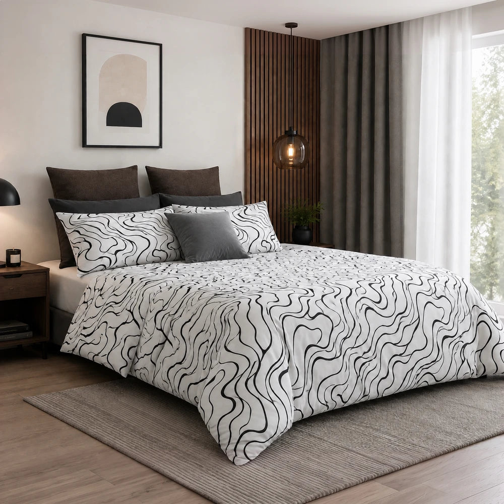 Horrockses Polycotton Duvet Cover Curve in white with black wavy line pattern and coordinating dark pillows