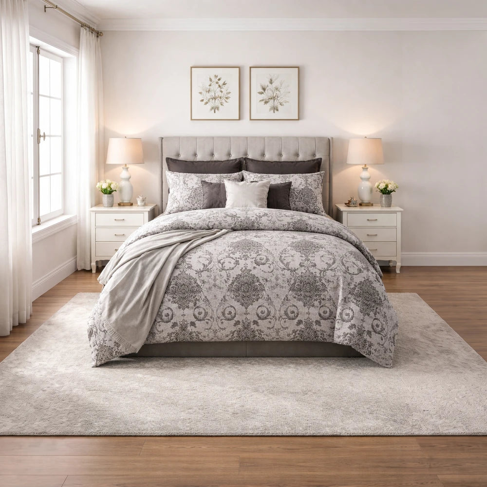 Horrockses Polycotton Duvet Cover in Emily Damask, gray damask pattern with coordinating pillowcases on a beige upholstered