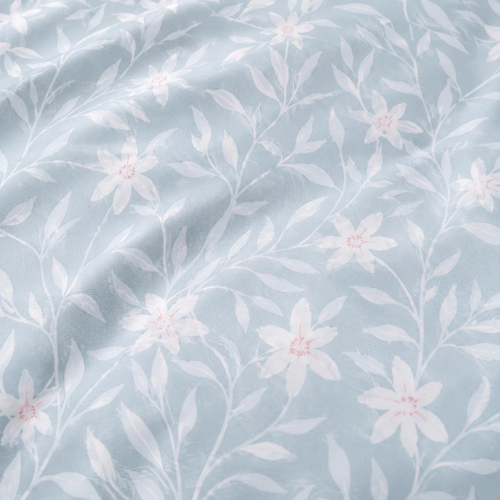 Horrockses Polycotton Duvet Cover Nikita in light blue with white floral pattern; breathable polycotton fabric.