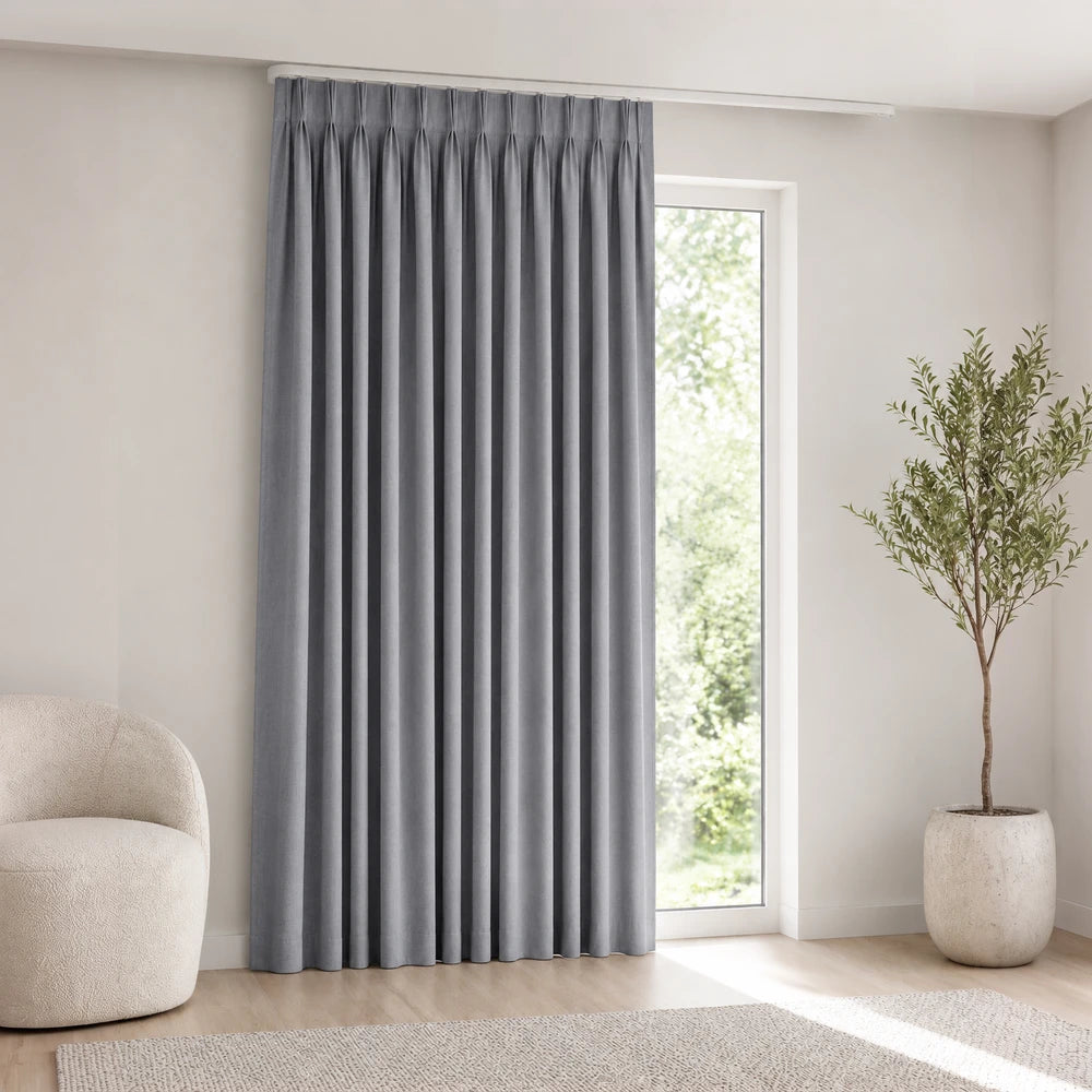 Linen-Look Unlined Taped Curtain in blue-gray fabric with a taped header, soft folds and neutral window coverage