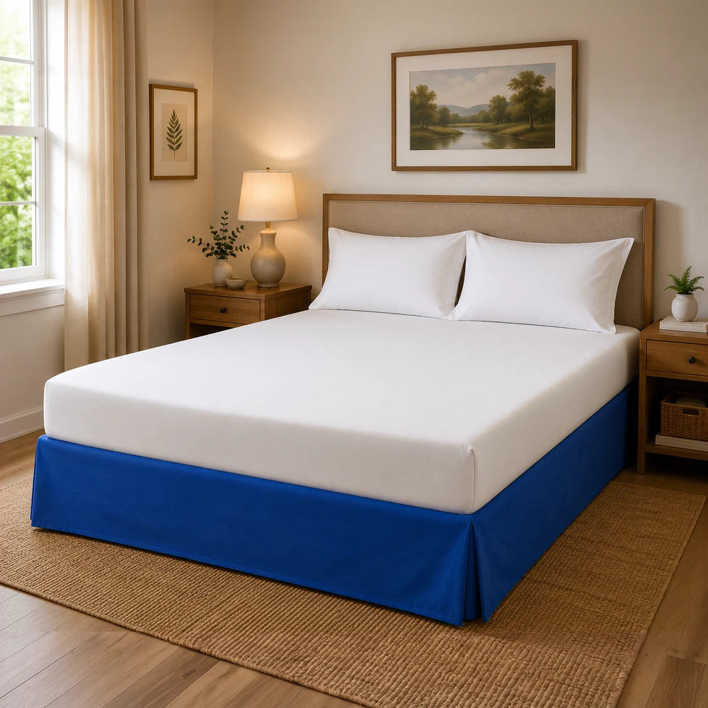 Microfibre Base Wrap on a bed with white sheets and a blue bed skirt, highlighting the base cover.