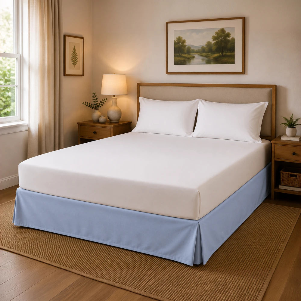 Microfibre Base Wrap on a neatly made bed with white sheets and a light blue base, in a cozy bedroom setting.