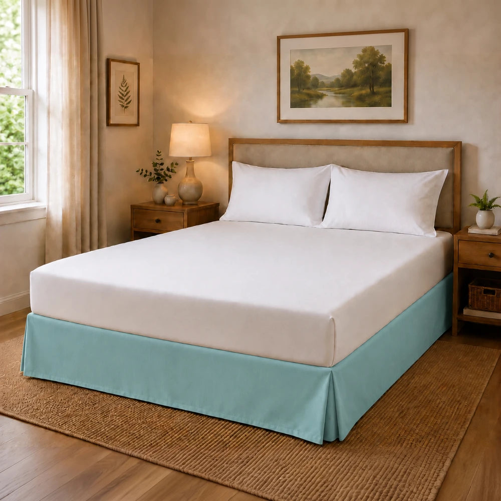 Microfibre Base Wrap in light blue rests on a neatly made bed with white sheets in a cozy bedroom.