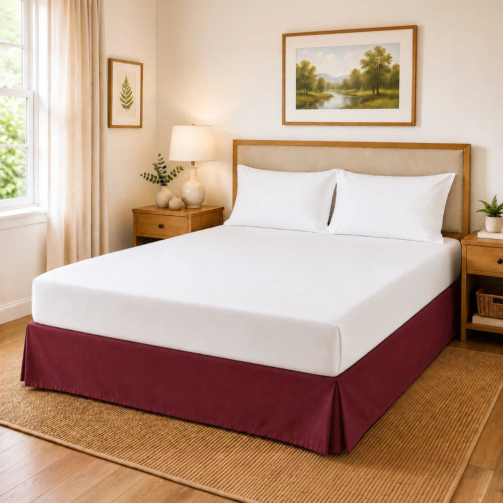 Microfibre Base Wrap on a neatly made bed with white sheets and a burgundy bed skirt in a tidy bedroom scene