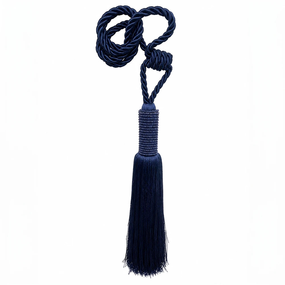 Curtain tieback in navy blue twisted rope with a long tassel, decorative drapery accessory for windows.