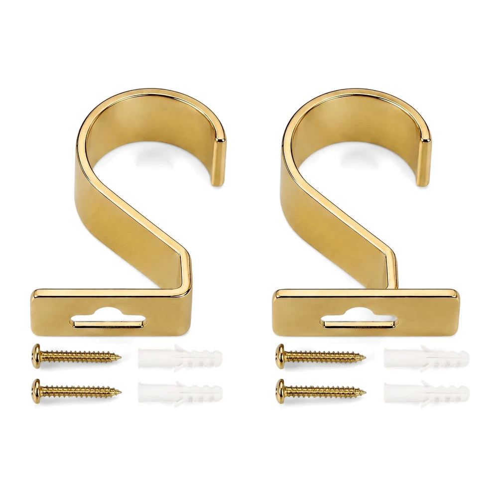 Pair of gold S-shaped single rod metal brackets, 25mm. Includes matching gold screws and white wall anchors for mounting.