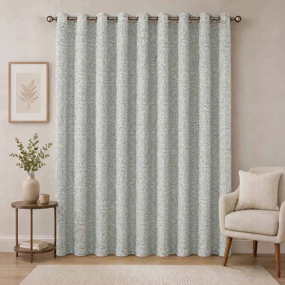 Pierre Cardin Eyelet Lined Jacquard Curtain in grey with subtle textured pattern, ideal for living room window coverage.