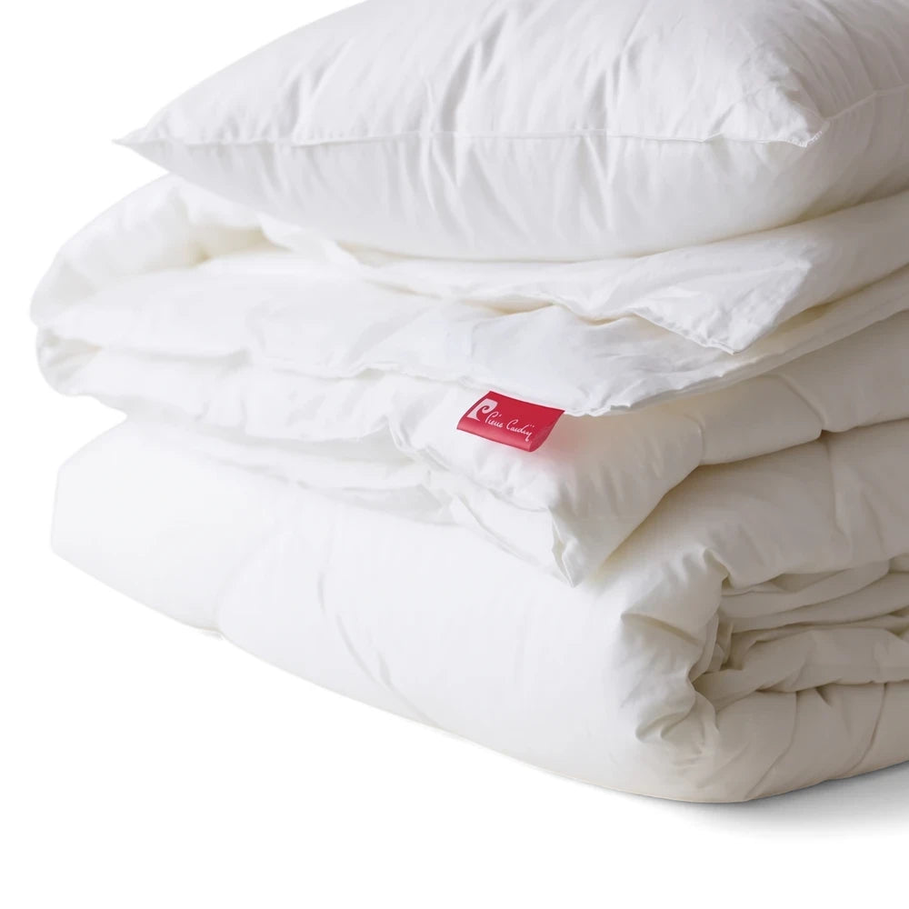 Pierre Cardin Hotel Edition Duvet Inner 233 TC, a white luxurious pillow and two folded comforters stacked.