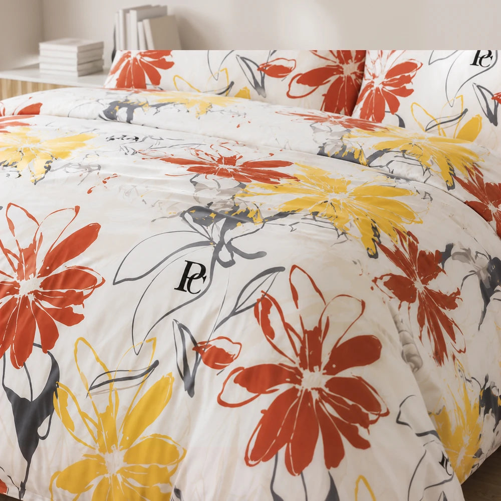 Pierre Cardin Microfibre Duvet Cover Set Leiya with bold red and yellow floral print on a white background, showcasing