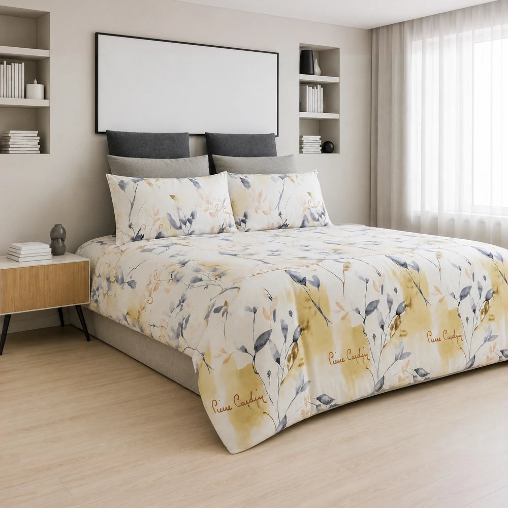 Pierre Cardin Microfibre Duvet Cover Set Peyton with pastel floral pattern in beige and gray, on a made bed.