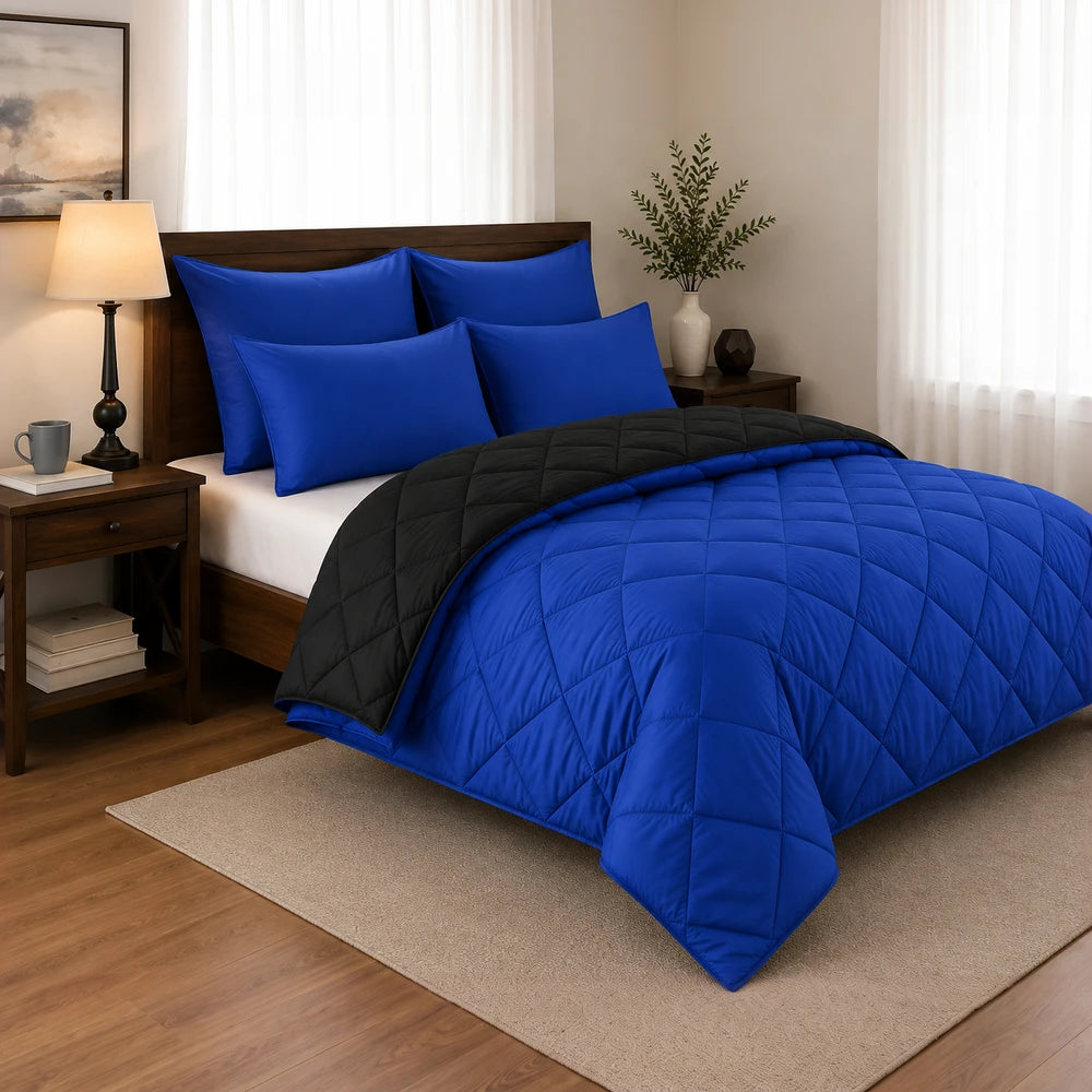 Pierre Cardin Monochrome Reversible Comforter set in royal blue with black reverse, includes matching blue pillow shams for