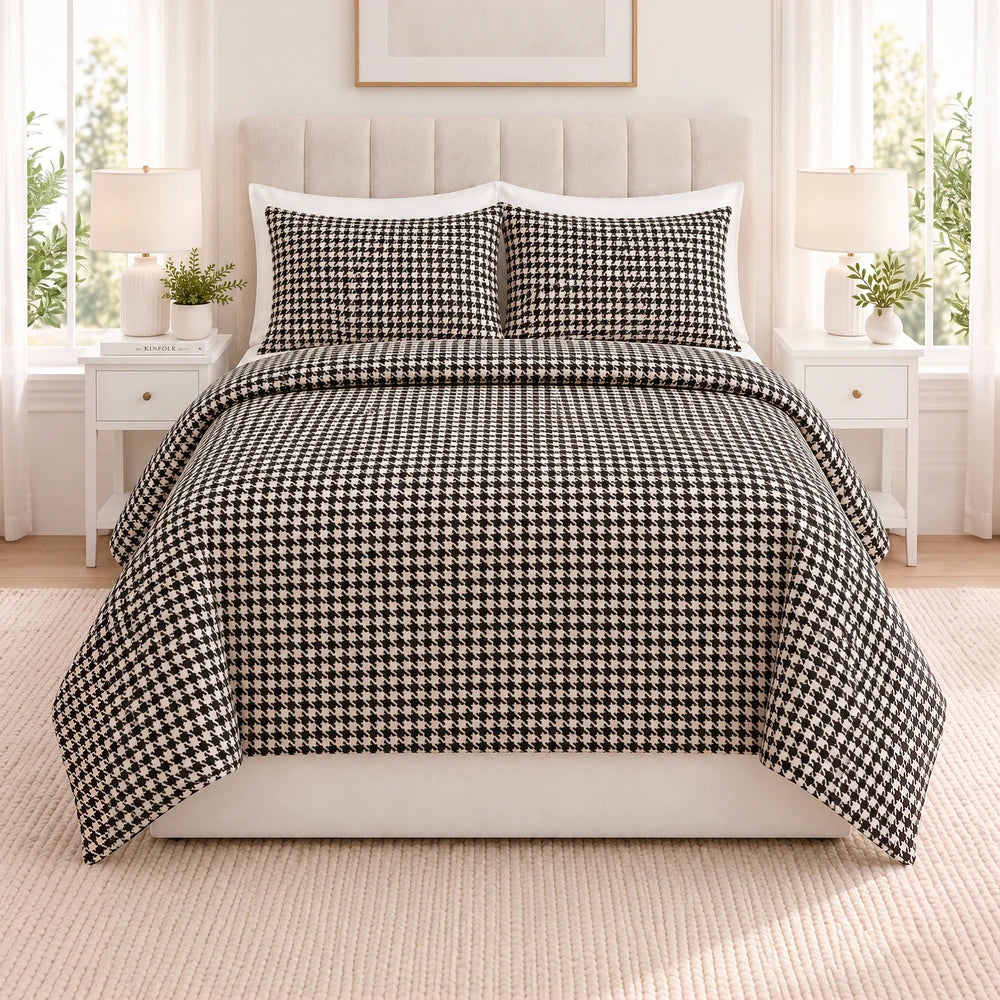 3Pc Pierre Cardin Printed Houndstooth Quilt set on a bed featuring a black and white houndstooth pattern.